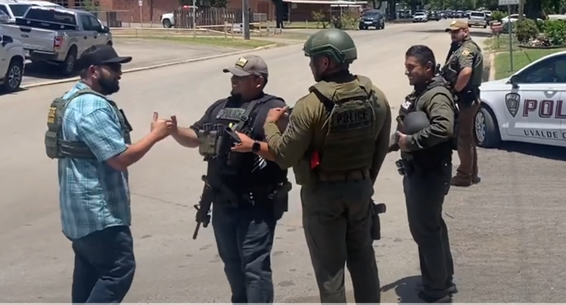 Disturbing video of officers laughing and fist bumping outside of Robb ...