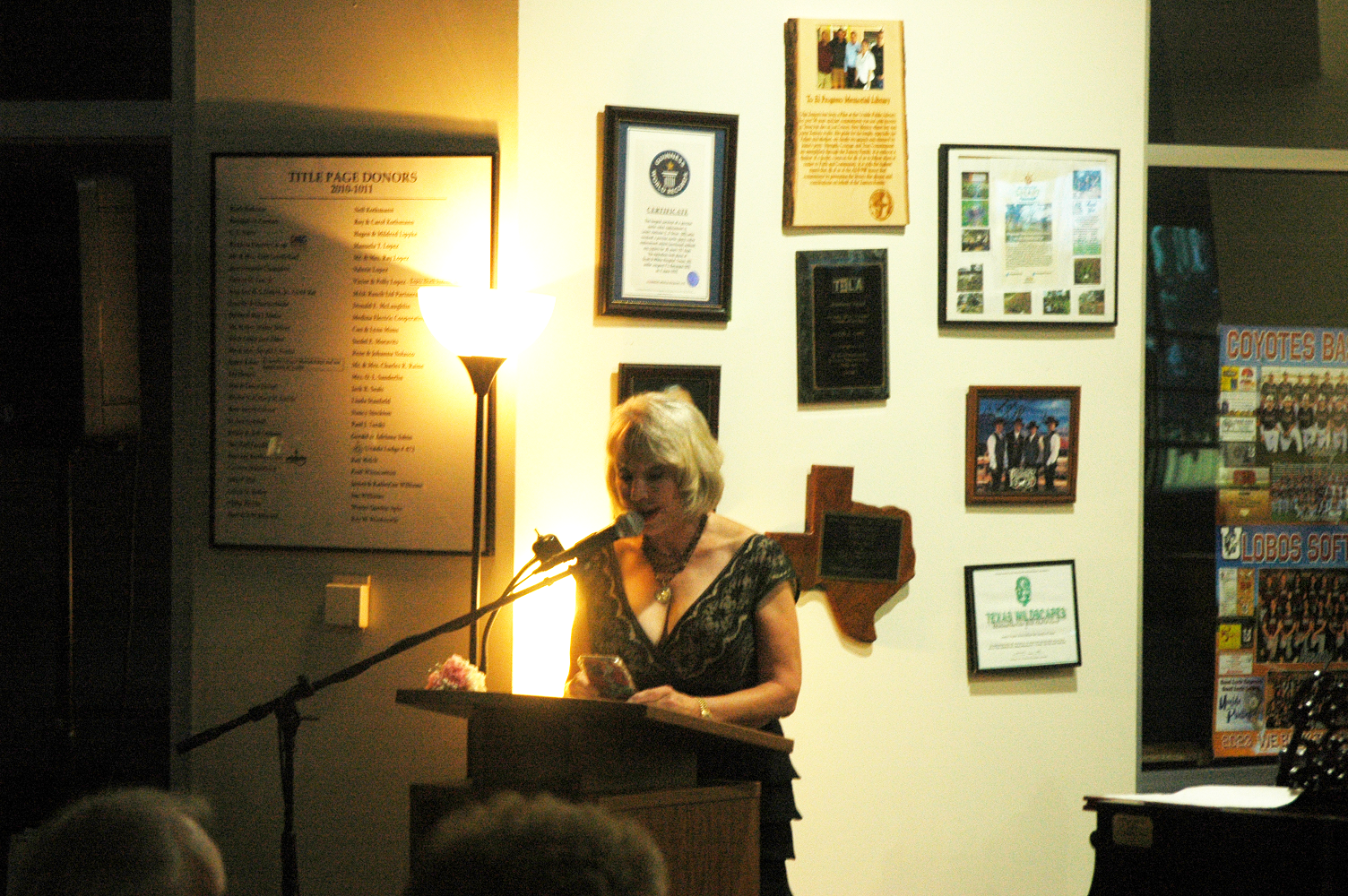 Emcee Linda Koehl introduces the next artists at the Music on Main" A Summer Serenade"