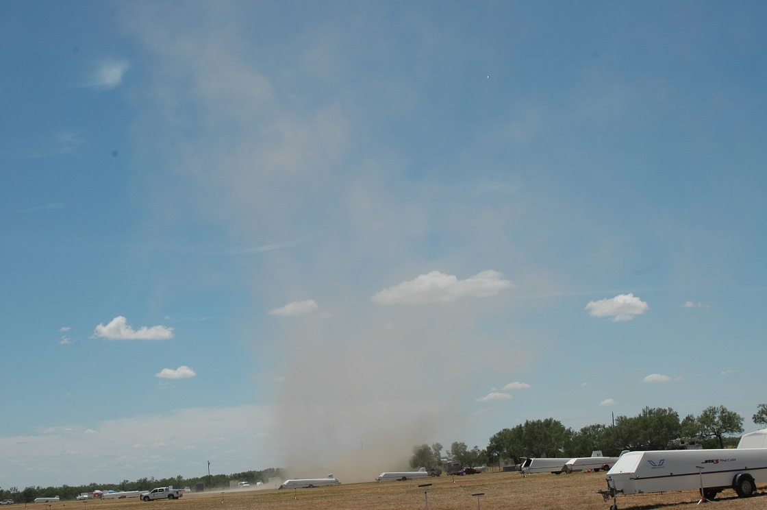 A large dust devils spins up near the western runway at Garner Field