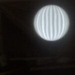 Image of a Ronchi grading optical test of the mirror’s surface 